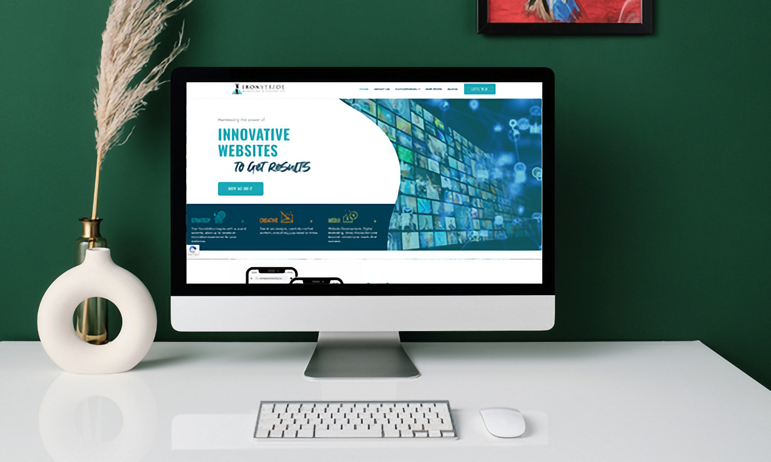 An iMac sits on a desk with the IronStride Digital Marketing homepage open on the screen.